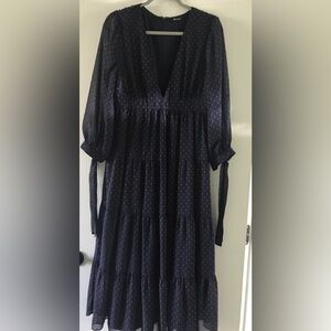 Navy blue dress with small pinky dots, has lining.